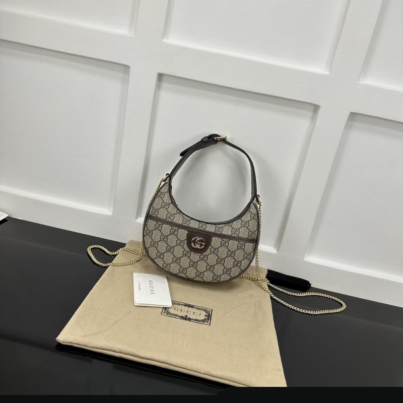 G*u*i top handle bags